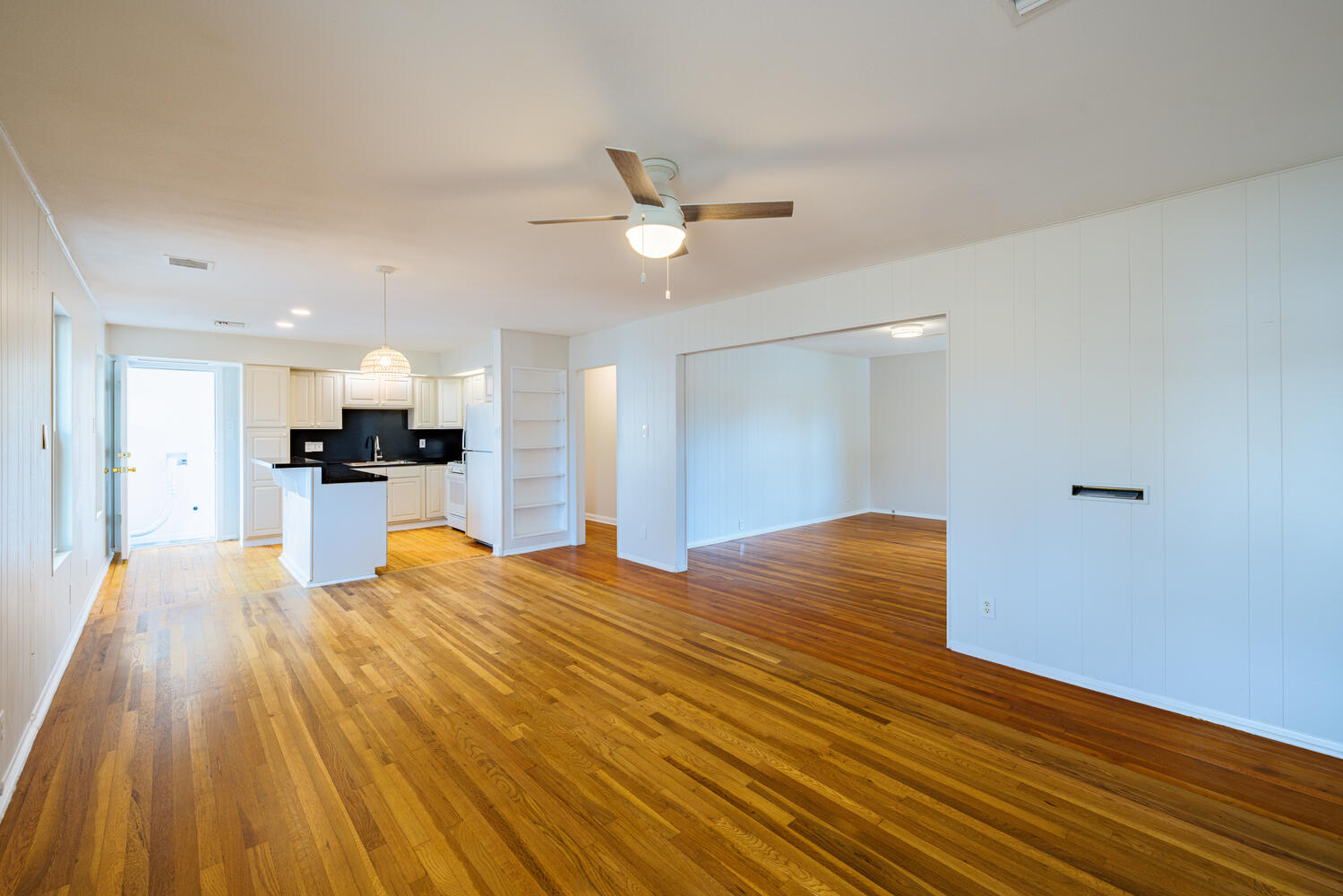 1400 Ruth Avenue Austin, TX 78757 - Photo 7 of 29 Polished hardwood floors flow seamlessly through this airy and open-concept layout.