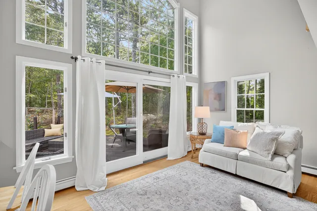 a living room with furniture fireplace and a table