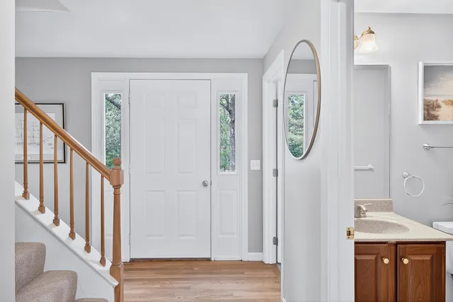 a bedroom with a bed and wall painting