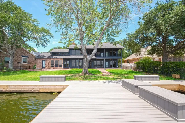 a view of a house with a yard and plants