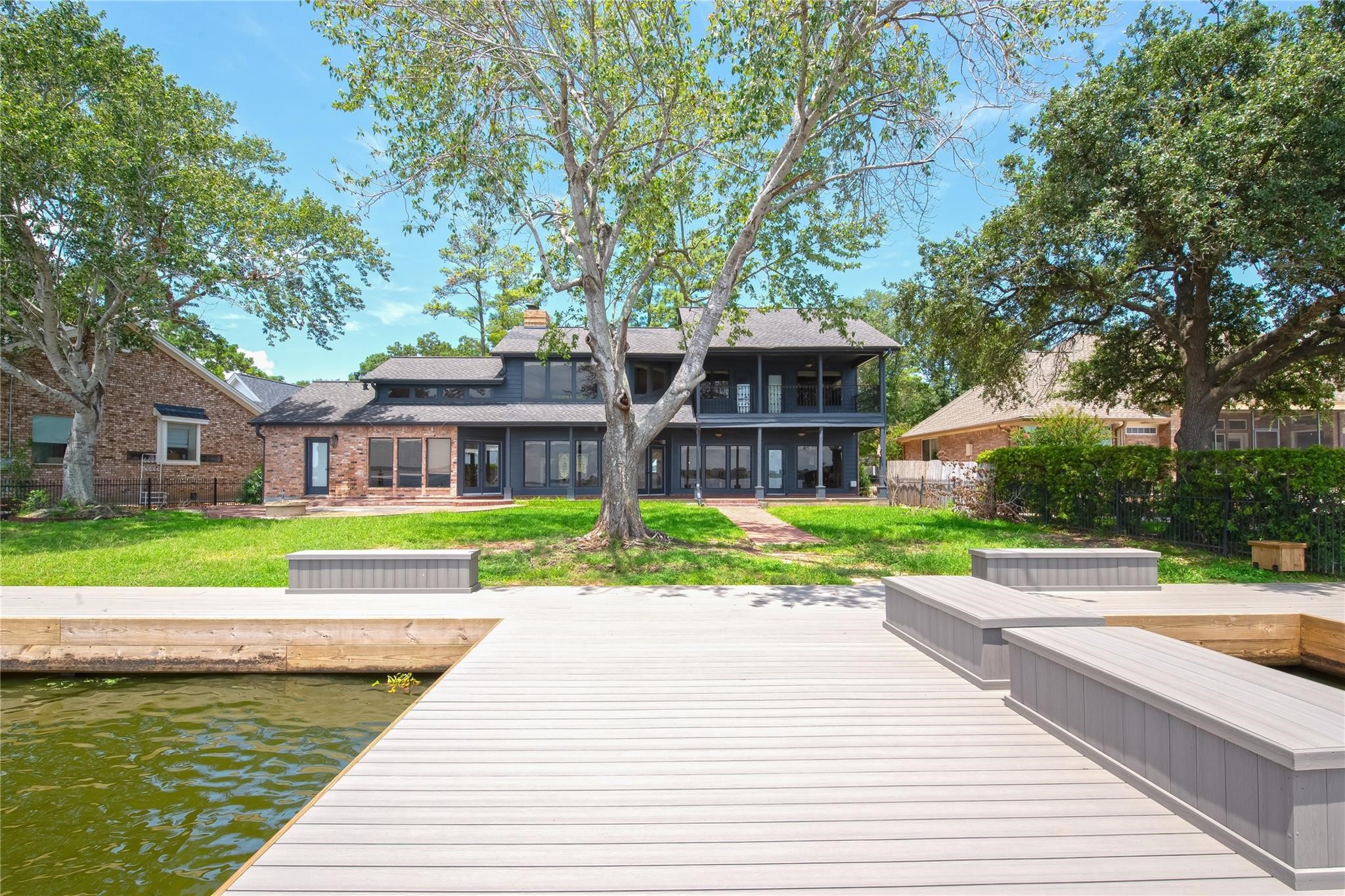 12098 Sagittarius East Willis, TX 77318 - Photo 1 of 37 a view of a house with a yard and plants