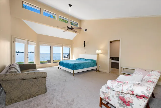 a bedroom with furniture and a chandelier