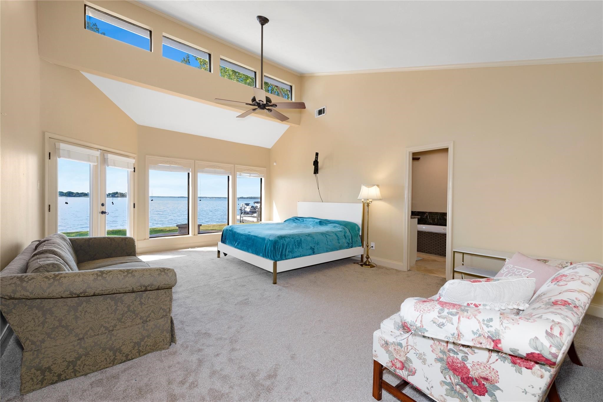12098 Sagittarius East Willis, TX 77318 - Photo 18 of 37 a bedroom with furniture and a chandelier