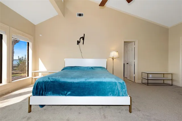 a bedroom with a bed and window