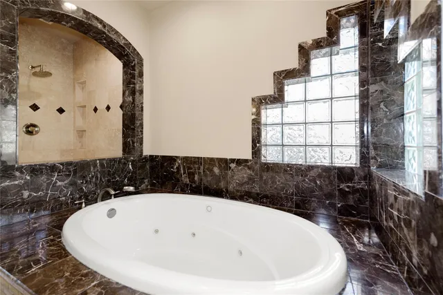 a bathroom with a bathtub and a sink