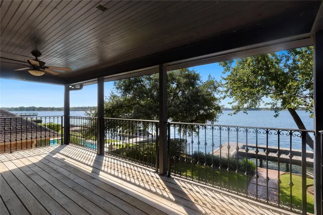 a view of a balcony with wooden floor