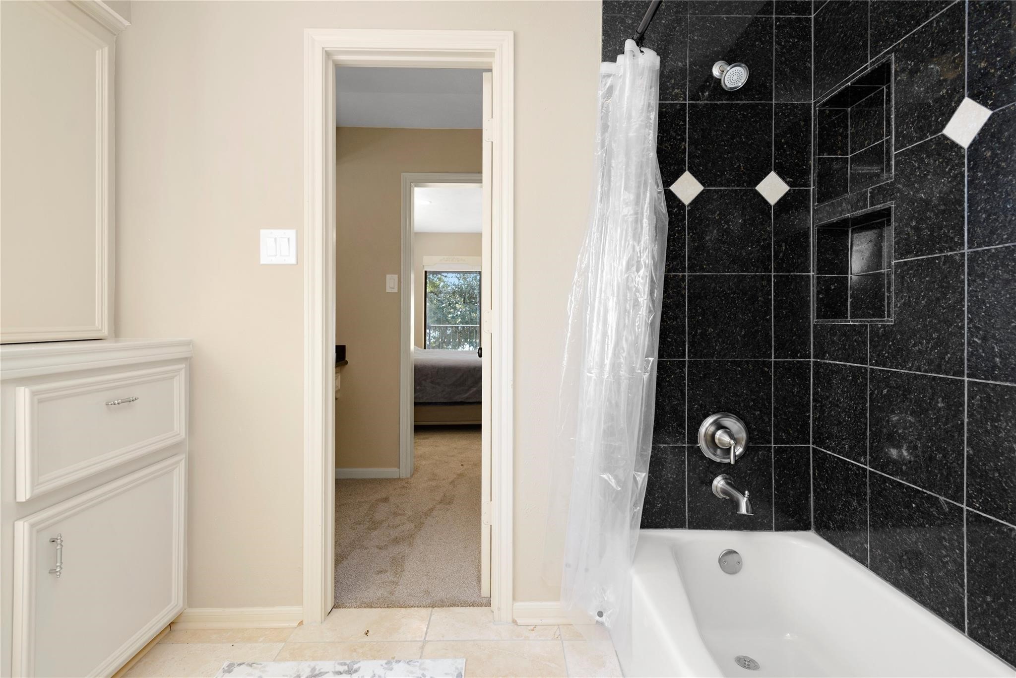 12098 Sagittarius East Willis, TX 77318 - Photo 29 of 37 a bathroom with a bathtub and shower