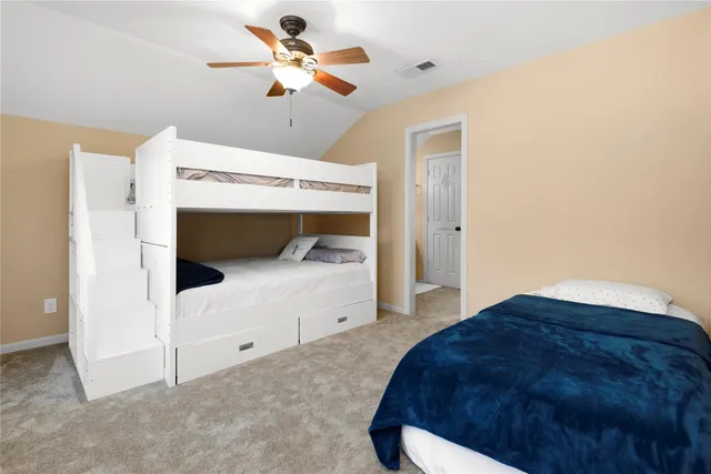 a bed room with a bed and a chandelier