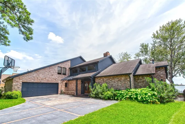 a view of a house with a garden and pathway