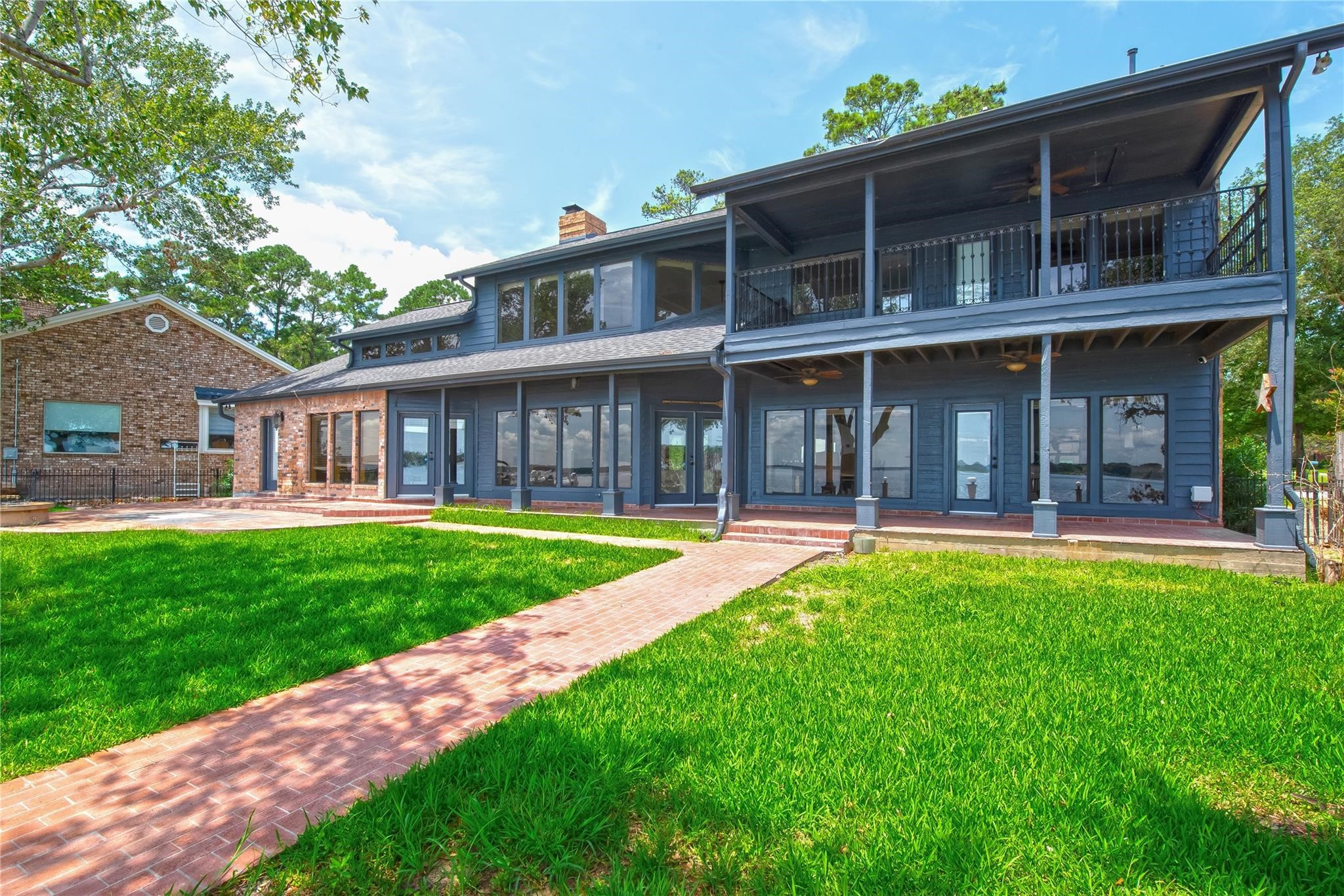 12098 Sagittarius East Willis, TX 77318 - Photo 31 of 37 a view of a house with a yard porch and sitting area