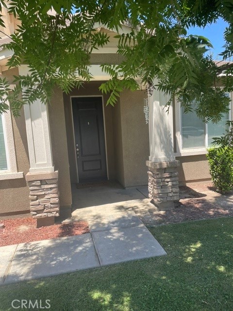 8011 Amber Creek Road Bakersfield, CA 93313 - Photo 1 of 8 Front with shade trees