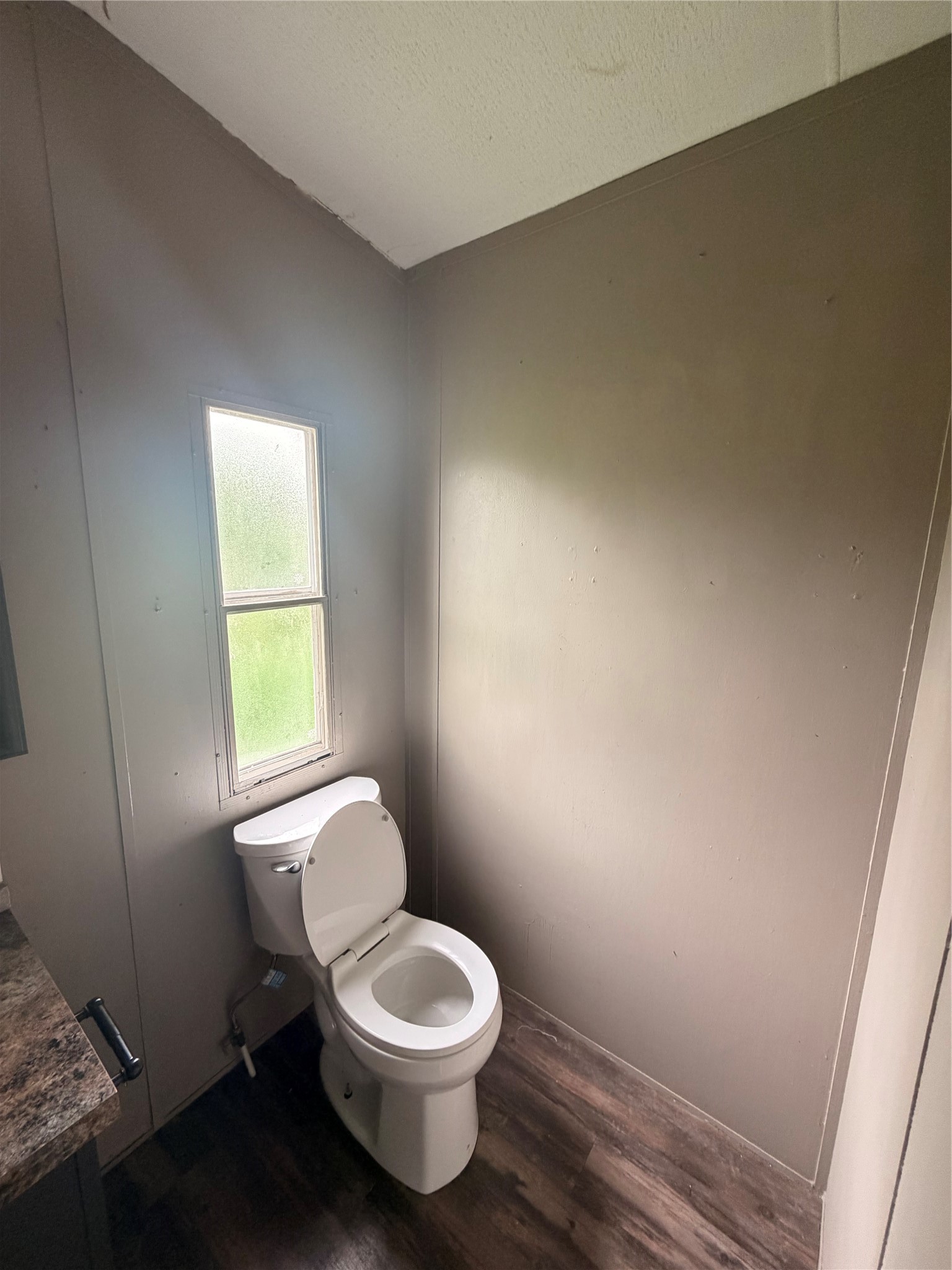 2021 North Battlebell Road, Unit 40 Highlands, TX 77562 - Photo 14 of 19 a white toilet sitting next to a window