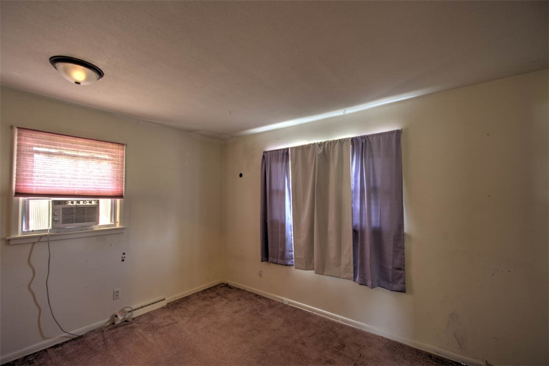 25 Ridge Drive Decatur, IL 62521 - Photo 15 of 24 an empty room with windows
