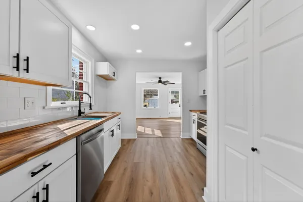 a kitchen with a sink and a stove