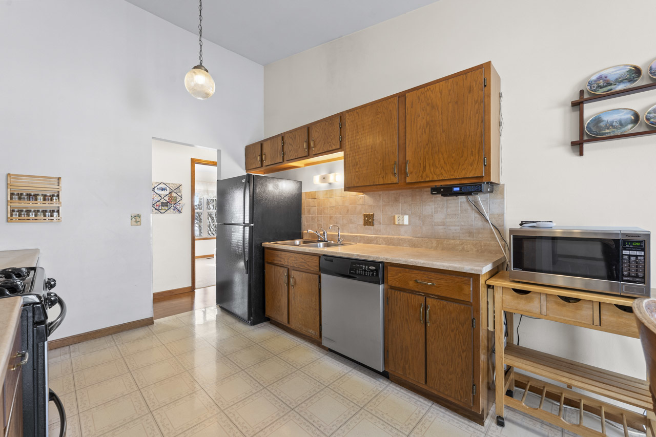 1106 Pheasant Trail Carol Stream, IL 60188 - Photo 15 of 33 a kitchen with stainless steel appliances granite countertop a sink stove and refrigerator