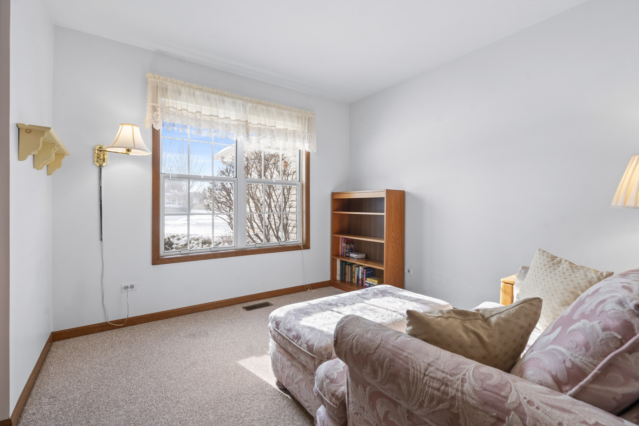 1106 Pheasant Trail Carol Stream, IL 60188 - Photo 21 of 33 a bedroom with a bed and a window