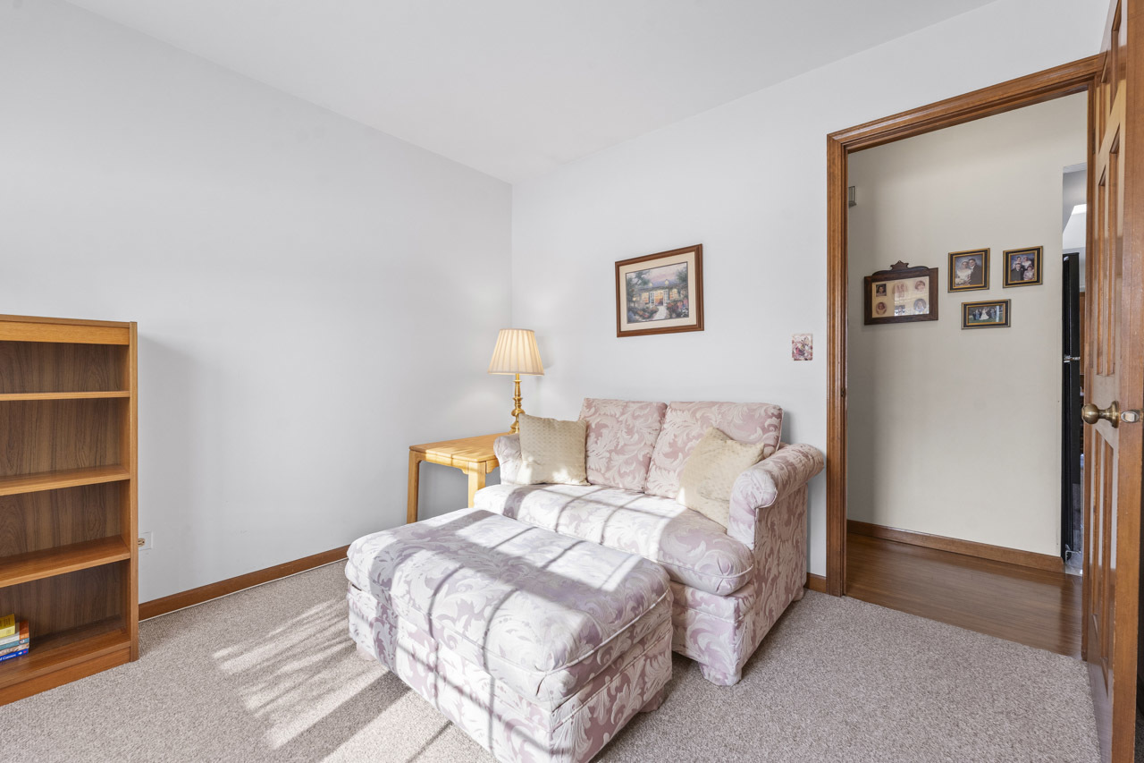 1106 Pheasant Trail Carol Stream, IL 60188 - Photo 22 of 33 a bedroom with a bed and a wall painting