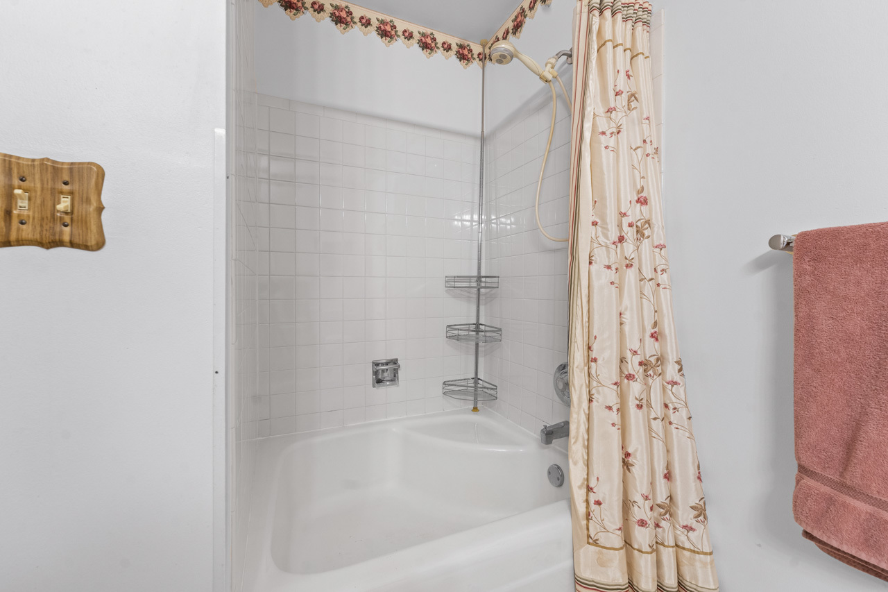 1106 Pheasant Trail Carol Stream, IL 60188 - Photo 24 of 33 a bathroom with a bathtub and a shower
