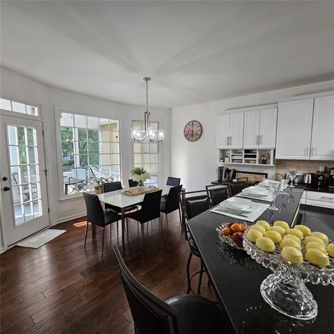 a living room with furniture flat screen tv and a fireplace