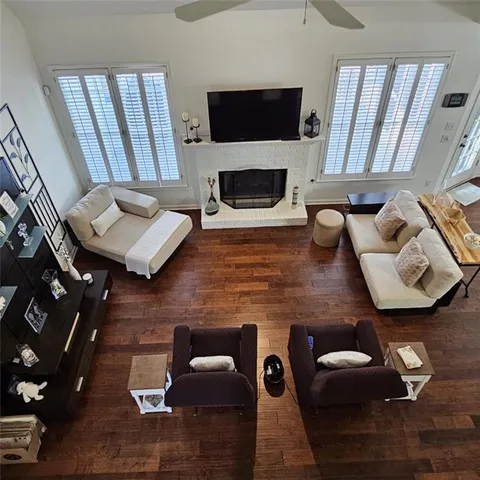 a kitchen with stainless steel appliances granite countertop a table chairs microwave and sink