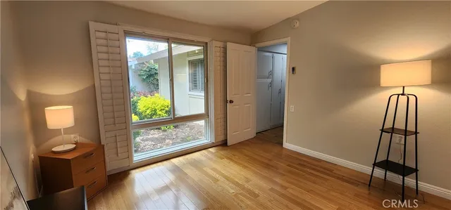a view of an entryway with wooden floor and a window