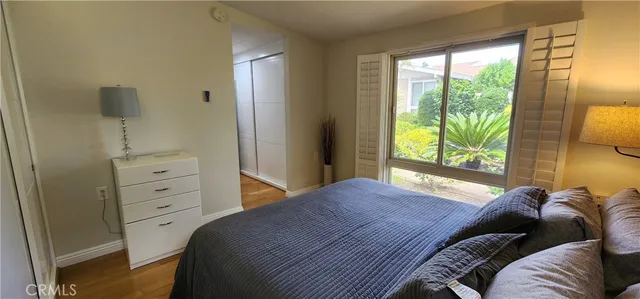 a bed room with a bed and a window