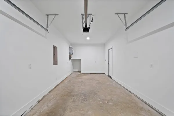 a view of a big room with cabinet and windows