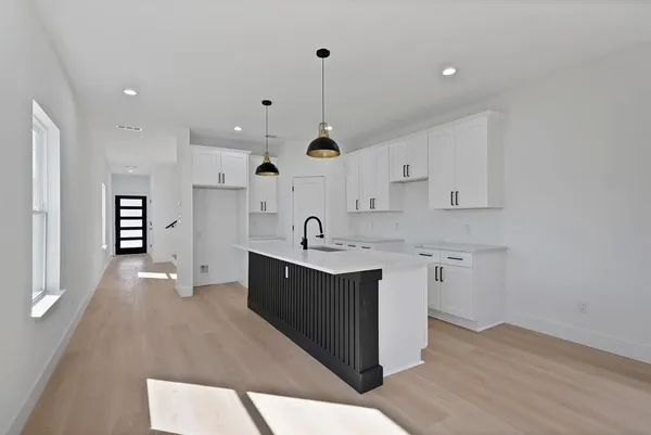 a view of a kitchen with electric appliances