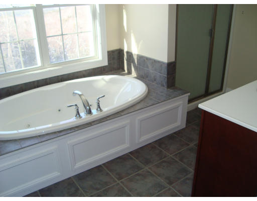 11 Marjorie Lane Rutland, MA 01543 - Photo 8 of 12 a bathroom with a sink and a window