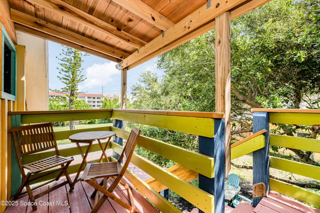 a kitchen with a table chairs refrigerator a sink and a stove