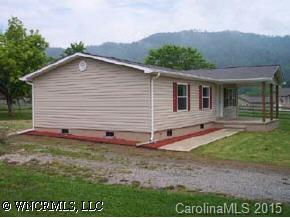 4438 Old River Road Waynesville, NC 28786 - Photo 2 of 8 a view of a house with backyard and garden