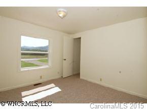 4438 Old River Road Waynesville, NC 28786 - Photo 5 of 8 a view of an empty room with a window