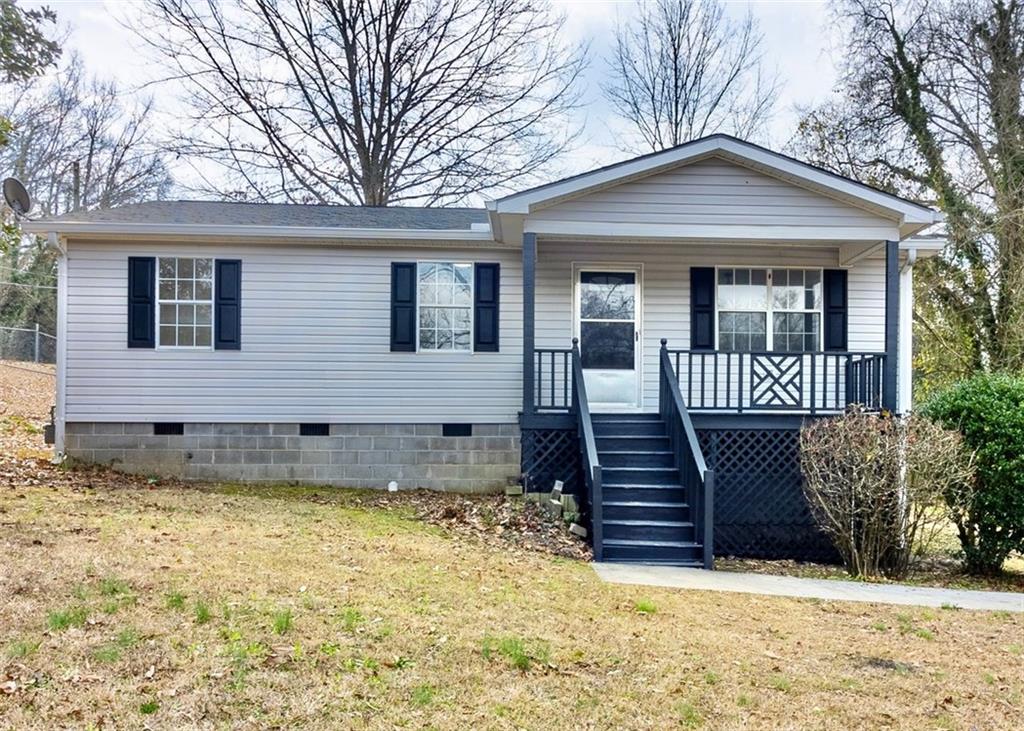 201 Myrtle Street Southwest Rome, GA 30161 - Photo 1 of 1 a front view of a house with a garden
