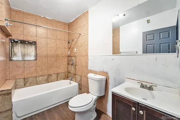 a bathroom with a sink toilet and bathtub
