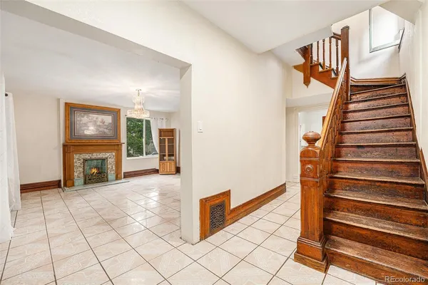 a view of an entryway with wooden floor and a rug