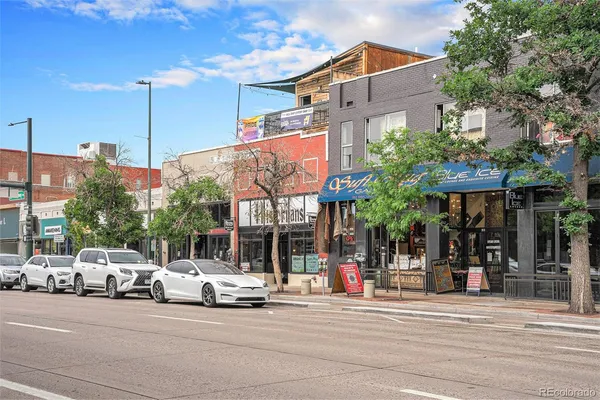 a view of a street with cars