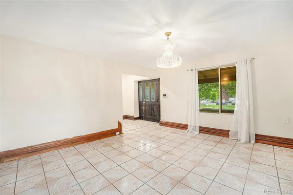 a view of an empty room and window