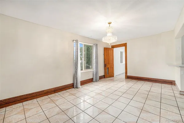 a view of an empty room and window