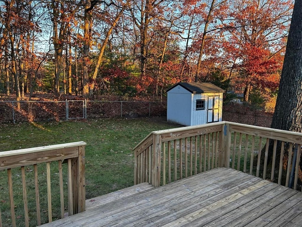 89 Gatewood Road Springfield, MA 01119 - Photo 7 of 30 a view of a wooden deck and a yard