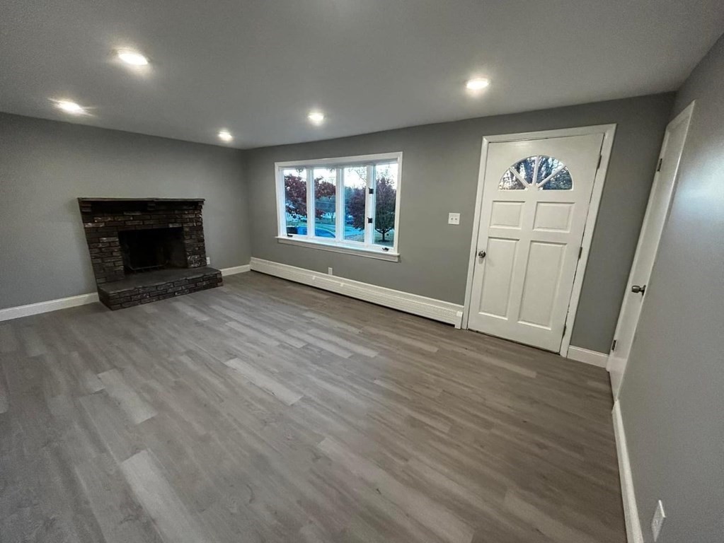 89 Gatewood Road Springfield, MA 01119 - Photo 8 of 30 an empty room with windows and fireplace
