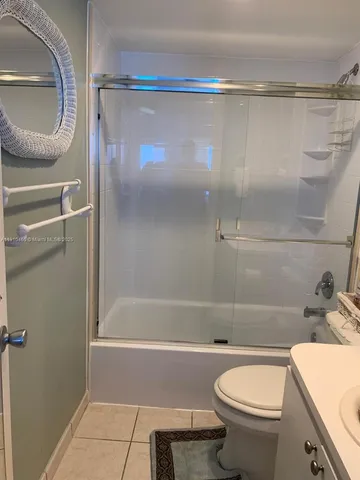 a bathroom with a sink a toilet and bathtub