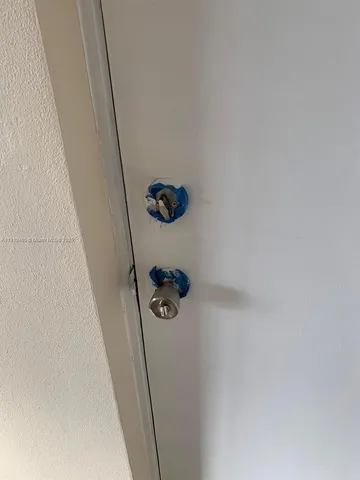 a bathroom with a granite countertop shower and a sink