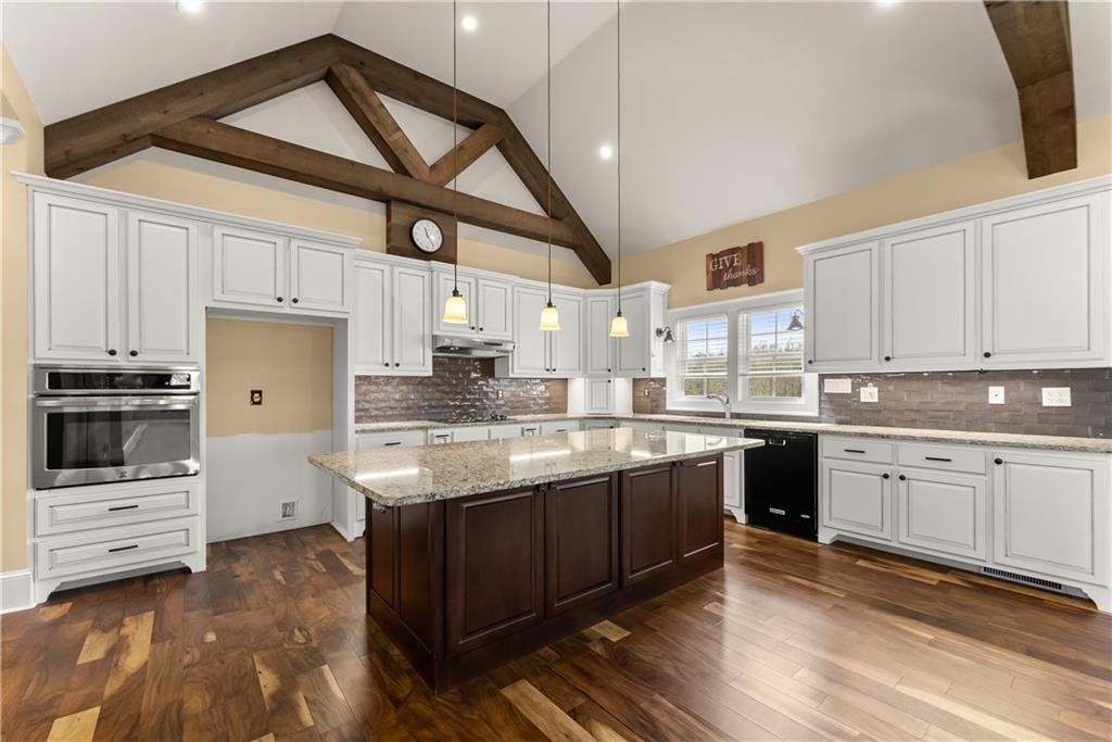 725 County Farm Road Jefferson, GA 30549 - Photo 20 of 66 a kitchen with granite countertop a sink cabinets stainless steel appliances and a counter top space