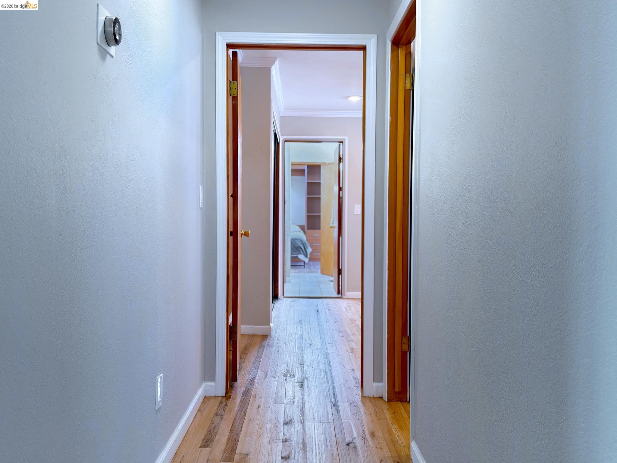 1732 Fernando Street Seaside, CA 93955 - Photo 21 of 53 Hallway featuring light wood-type flooring and ornamental molding
