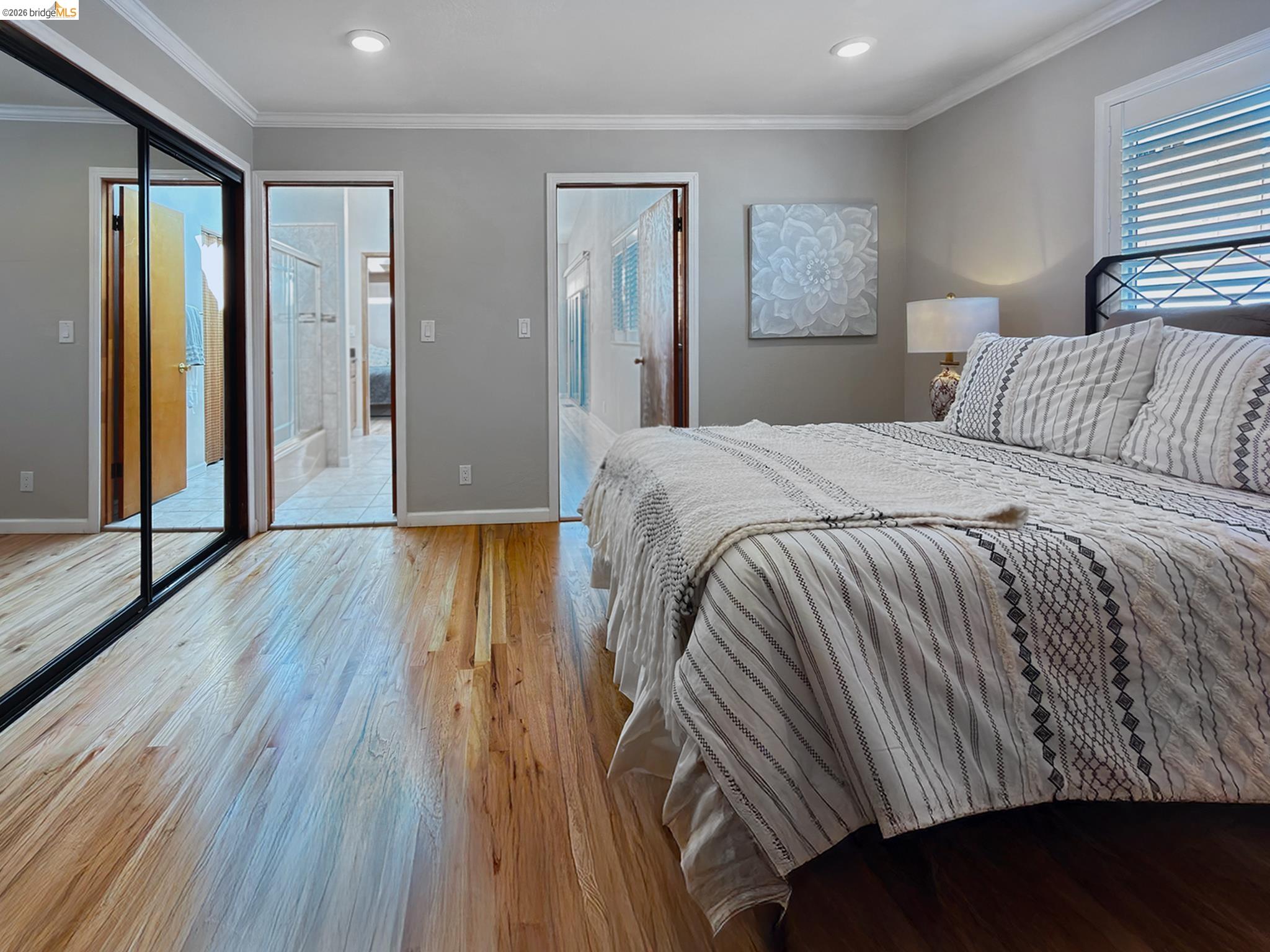 1732 Fernando Street Seaside, CA 93955 - Photo 35 of 53 Bedroom featuring ornamental molding, a closet, light wood-style flooring, and ensuite bath