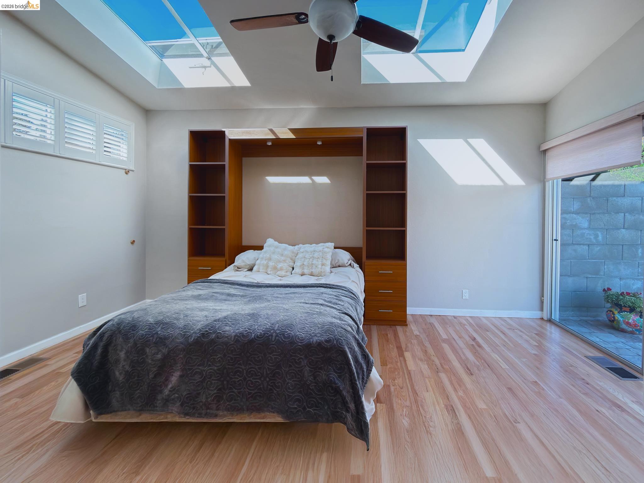 1732 Fernando Street Seaside, CA 93955 - Photo 36 of 53 Bedroom featuring a skylight, light wood-style floors, lofted ceiling, ceiling fan, and access to exterior