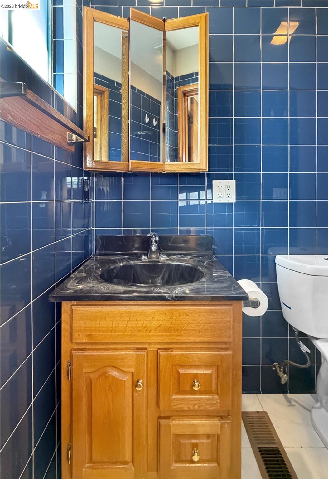 1732 Fernando Street Seaside, CA 93955 - Photo 41 of 53 Bathroom featuring tile walls, vanity, and light tile patterned floors