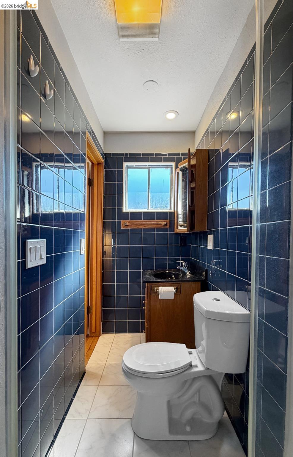 1732 Fernando Street Seaside, CA 93955 - Photo 42 of 53 Bathroom featuring tile walls, vanity, and a textured ceiling