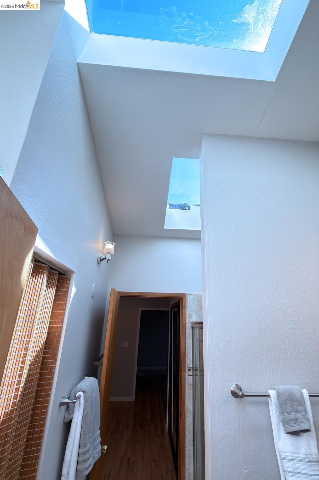 1732 Fernando Street Seaside, CA 93955 - Photo 48 of 53 Bathroom with a skylight, a textured wall, wood finished floors, and a shower with shower door