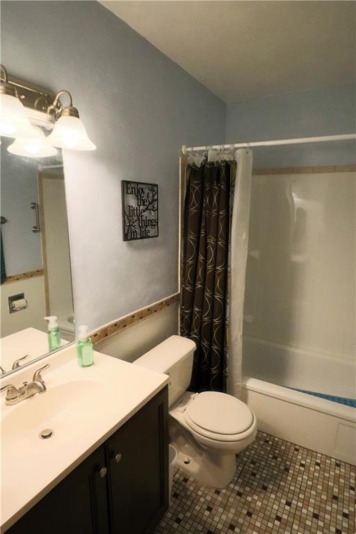 1340 Barkley Road McKeesport, PA 15133 - Photo 12 of 20 a bathroom with a sink a toilet and shower